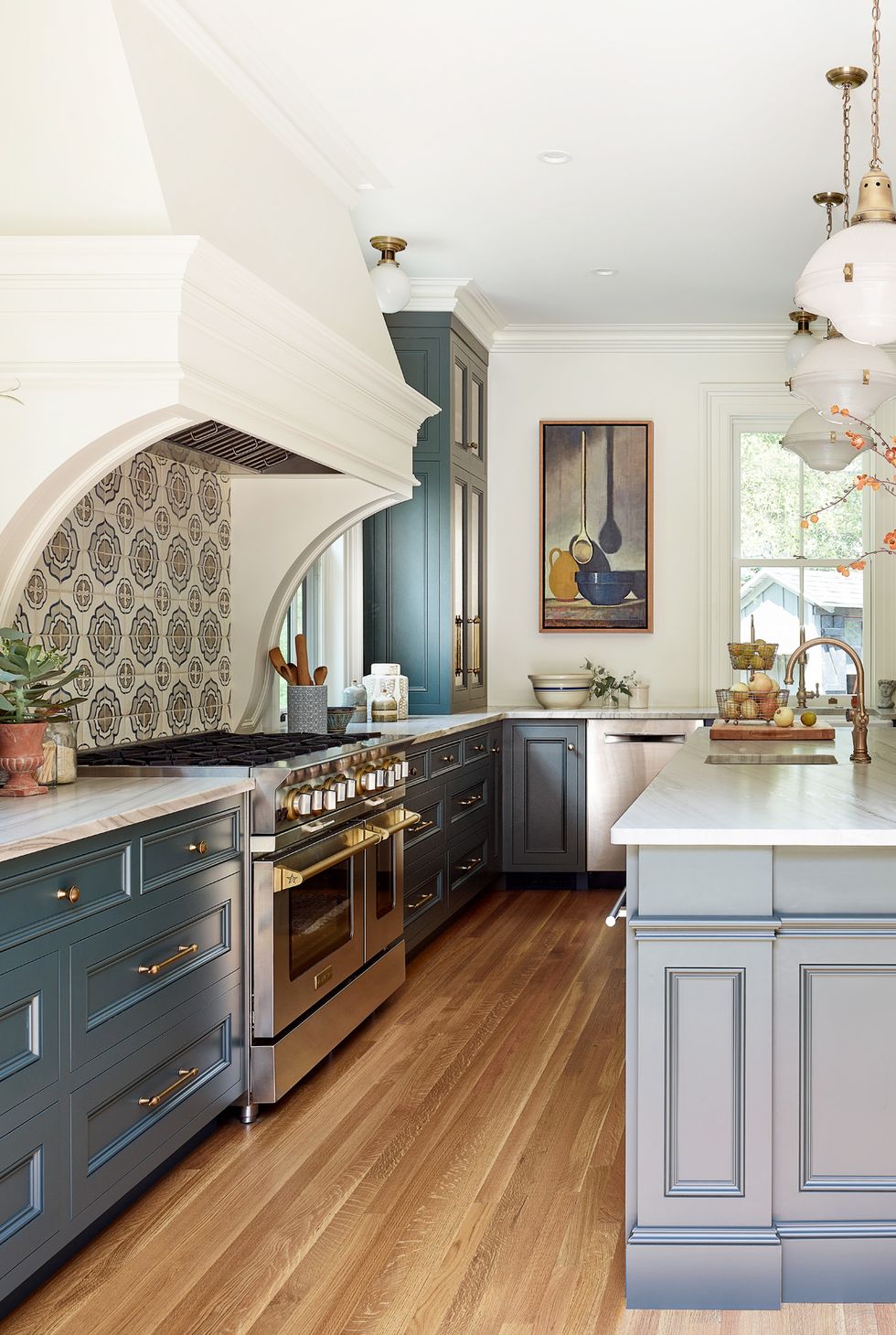 english inspired kitchen with blue green cabinets